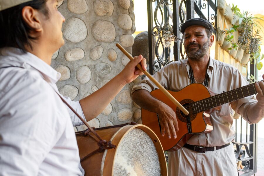 A Man Holding an Acoustic Guitar