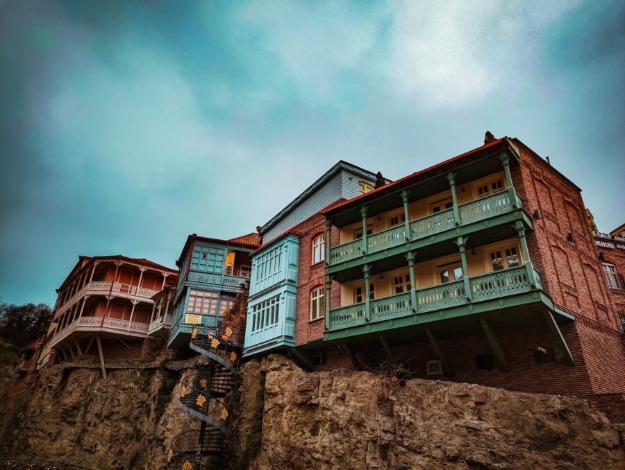 Clouds over Vintage Houses on Rocks in Tbilisi
