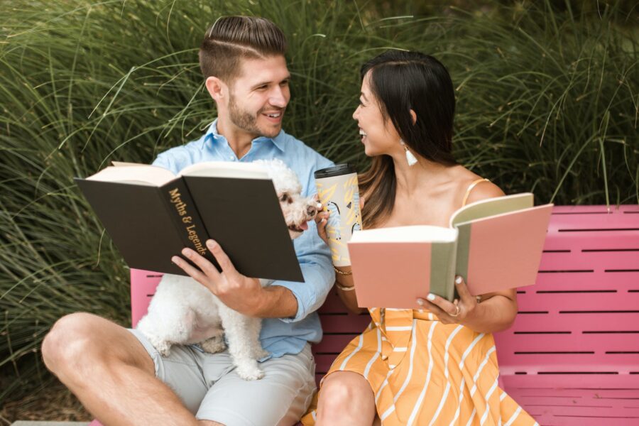Couple Talking while Holding Books