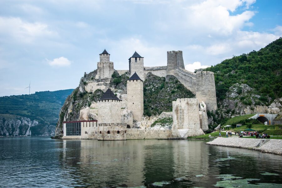 Gray Concrete Castle Beside Body of Water