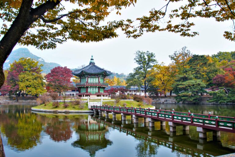 Gyeongbokgung Palace in the Middle of the Lake Surrounded with Autumn Trees