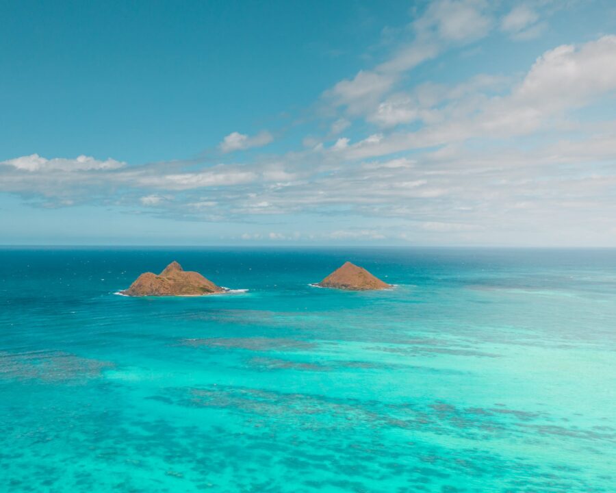 Islands on Turquoise Water Under a Blue Sky With White Clouds