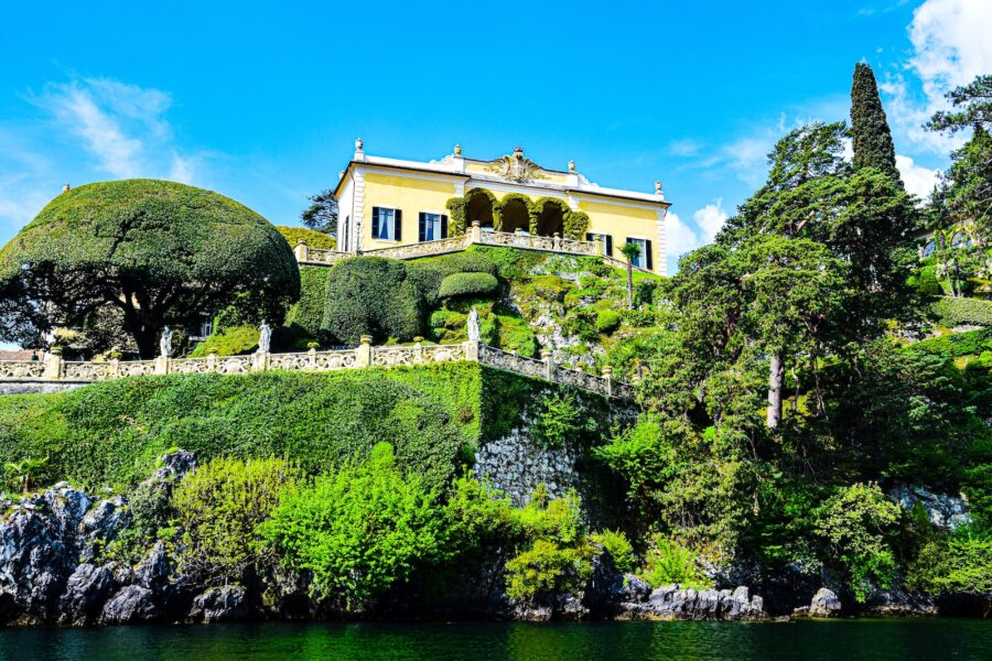 a house on a hill with trees around it