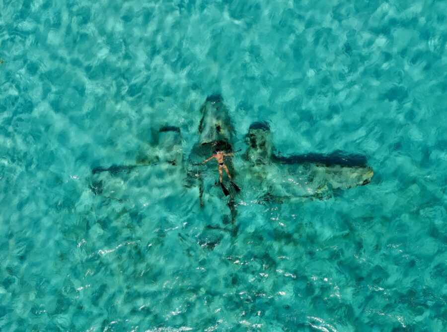 Man Floating above a Plane Wreck