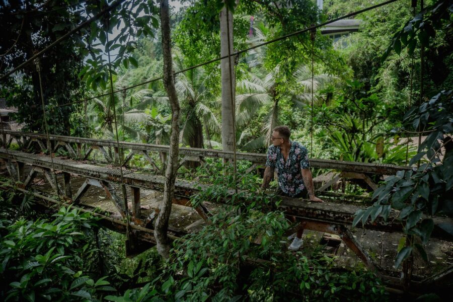 Man Standing on an Old Wooden Bridge in Ubud, Bali