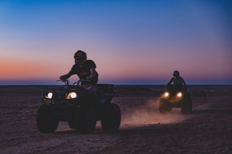 Men Riding ATV on Beach