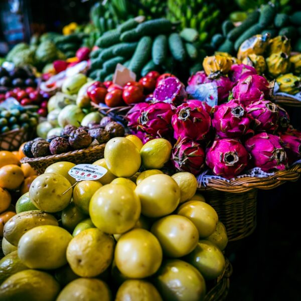 a variety of fruits and vegetables on display at a market