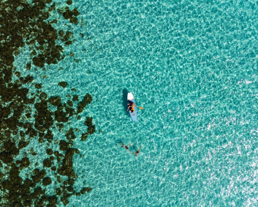 People Kayaking on Blue Lagoon
