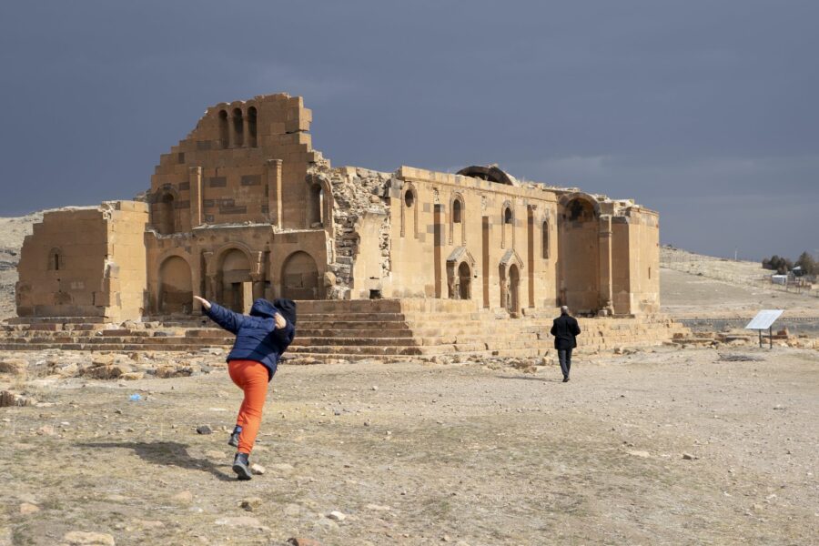 People Outside of the ruins of Yererouk Basilica in Anipemza, Armenia