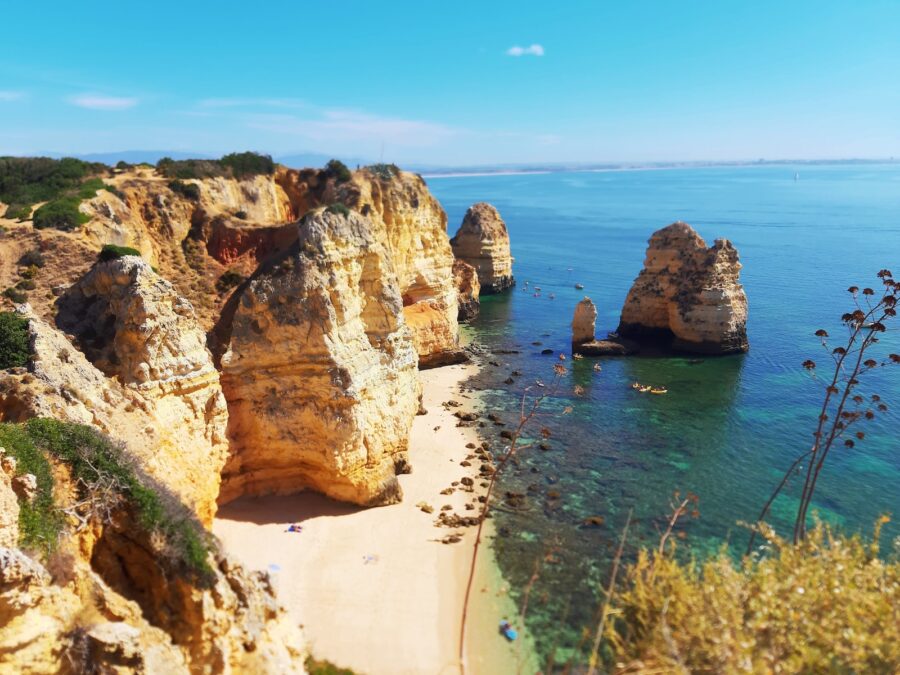 brown rock formation on sea during daytime