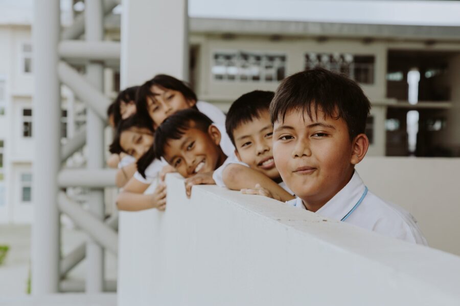 Smiling Boys and Girls in School Uniforms