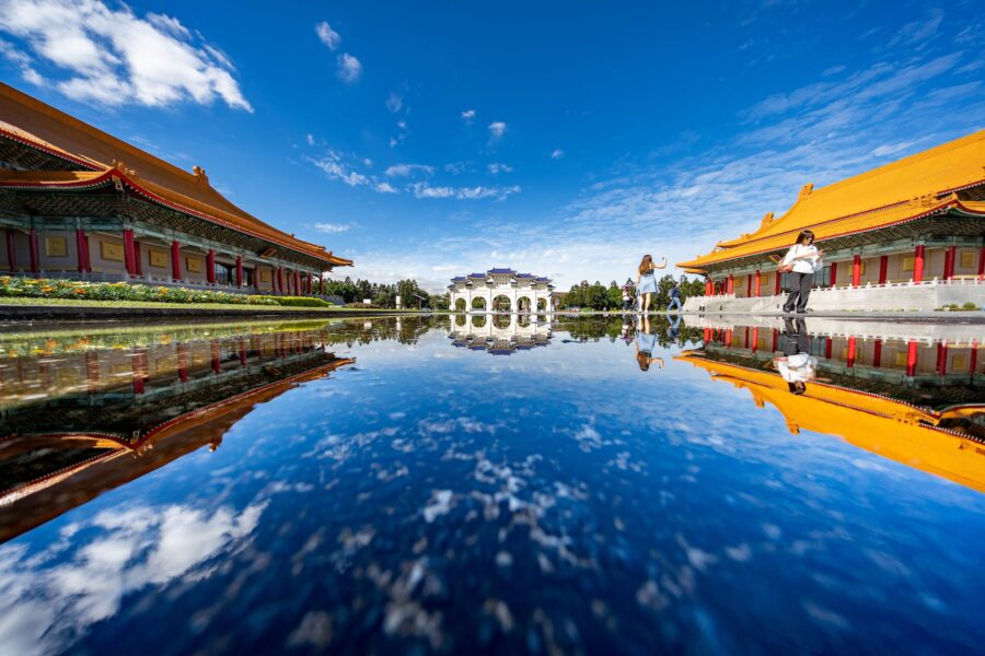 Traditional pool with oriental buildings of memorial complex