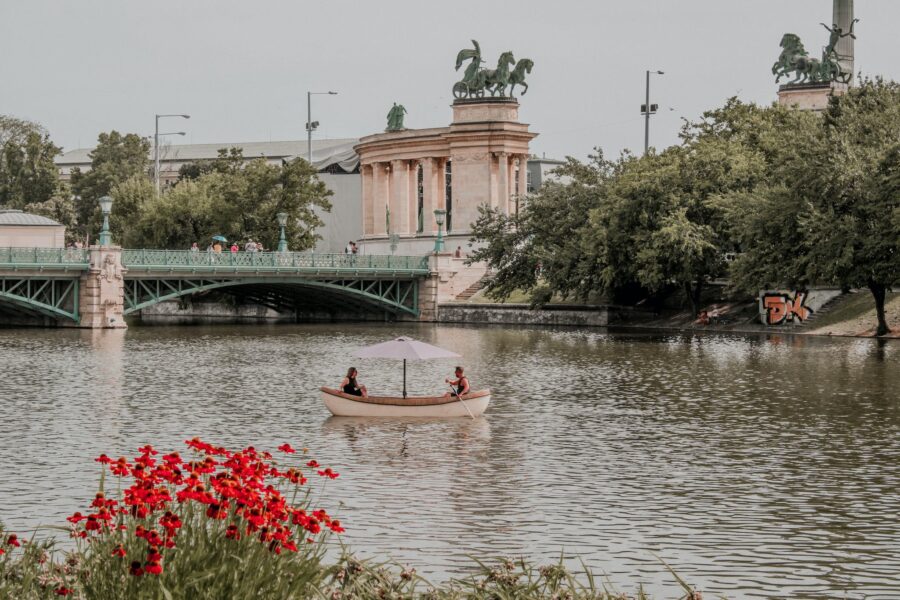 Two People On Boat At A River