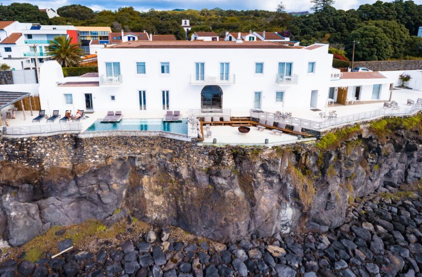 White and Brown Concrete Building On A Cliff