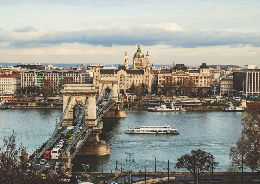 bridge over body of water in front of buildings