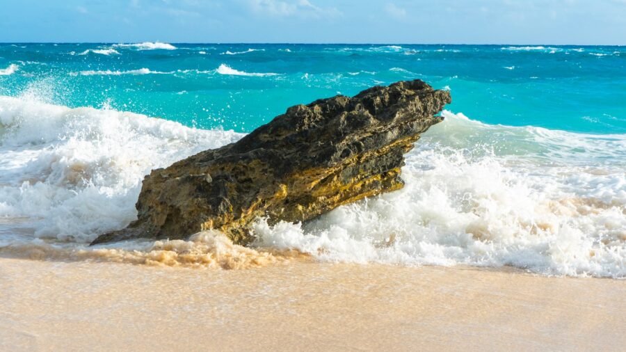 brown rock formation on sea shore during daytime