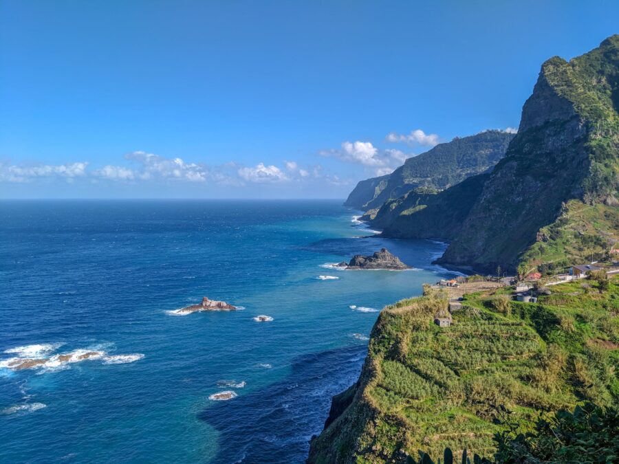 A Mountain Near the Body of Water Under the Blue Sky