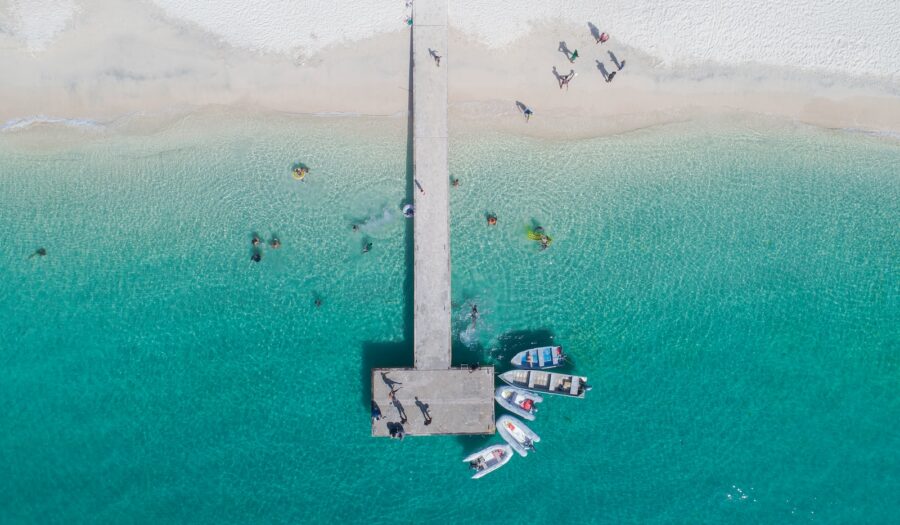 white and black boat on sea during daytime