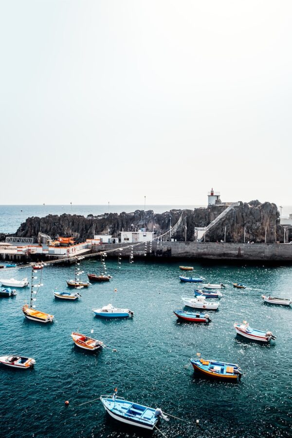 boat on ocean near islet