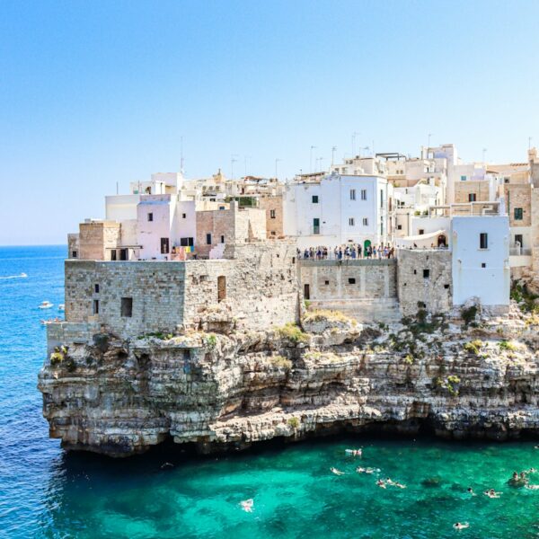 white concrete building near body of water during daytime
