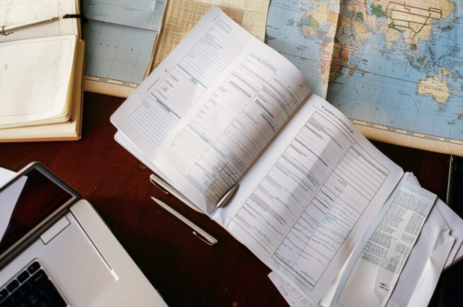 offshore corporation's documents arranged on a desk with a world map